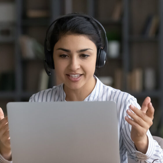 Confident,Millennial,Indian,Female,Coach,Tutor,In,Modern,Headphone,Set